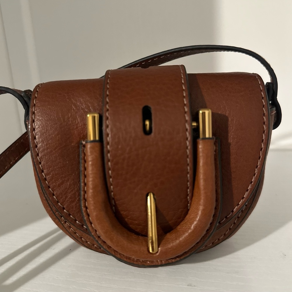 Fossil Harwell Mini Flap Crossbody Bag and the Fossil Heritage Trifold.